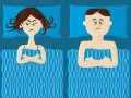 Couple au lit, bras croisés, l'air boudeur. Elle semble vouloir se faire désirer après avoir couché, lui est visiblement contrarié.