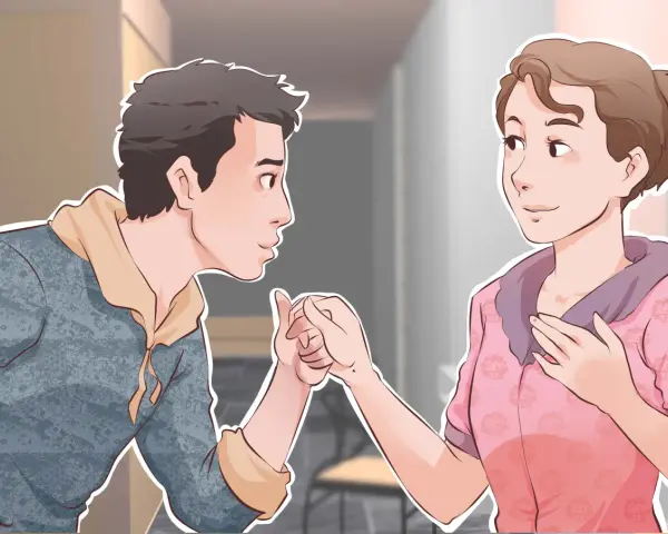 Un garçon tient la main d'une fille, un geste tendre pour lui montrer comment plaire à un garçon.