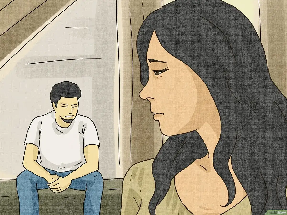 Un homme qui n'a pas confiance en lui est assis, le regard baiss&eacute;, tandis qu'une femme se tient &agrave; l'&eacute;cart, l'air pensif.